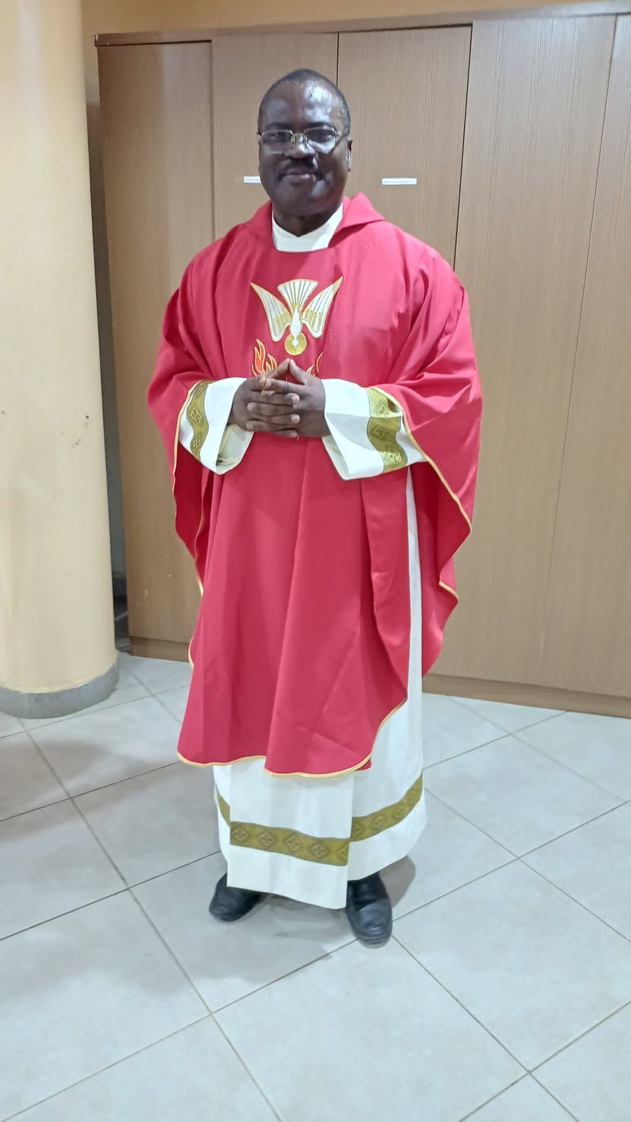 Padre Mike in red vestments