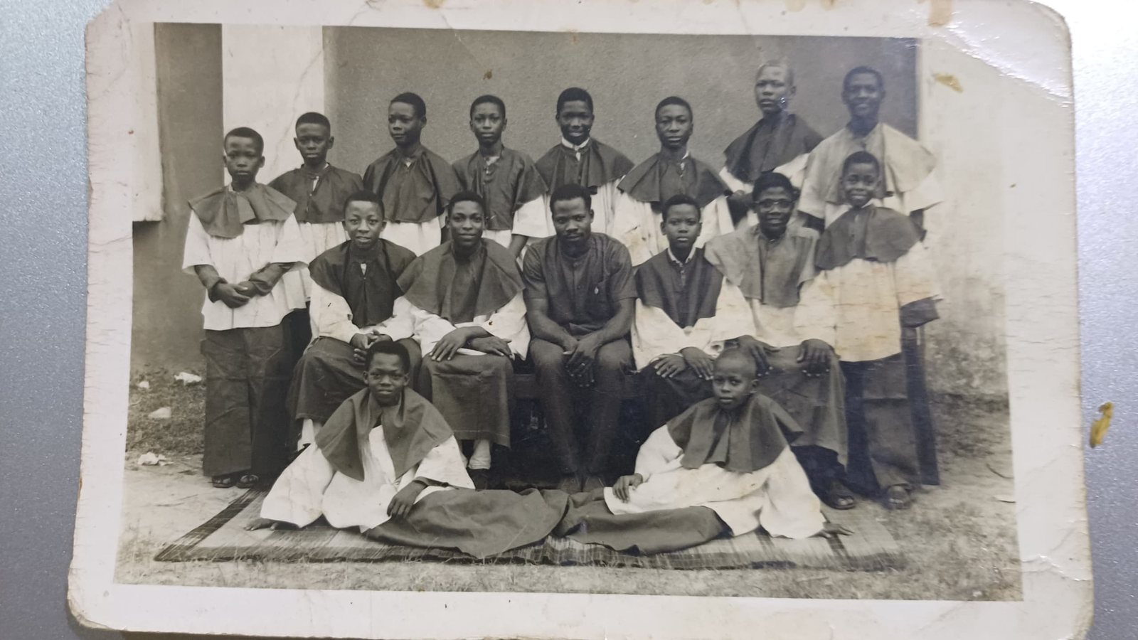An old group photograph of young altar servers in cassocks and surplices, from Padre Mike’s archive
